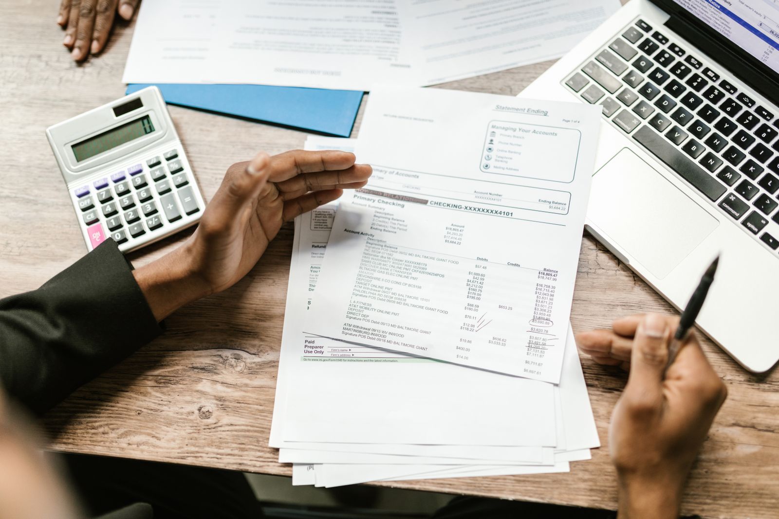 Financial paperwork and a calculator on a desk