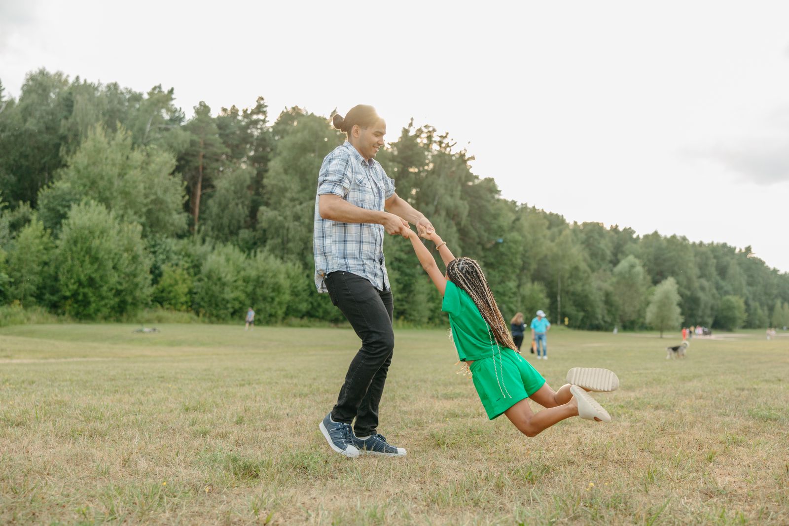 A parent and child spending the afternoon together at a park